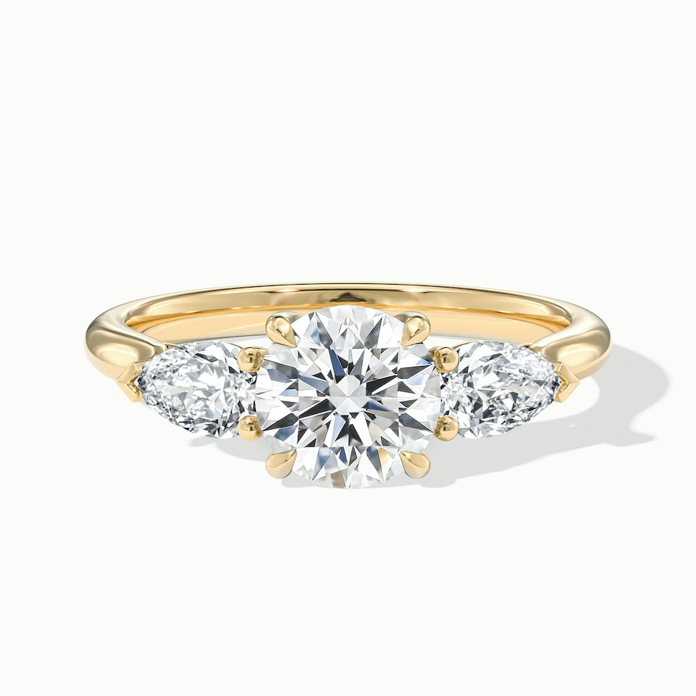 Amaya 1.5 Carat Round 3 Stone Moissanite Diamond Ring With Pear Side Stone in 18k Yellow Gold